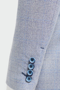 Close-up of a light blue checkered suit with three buttons on a white background
